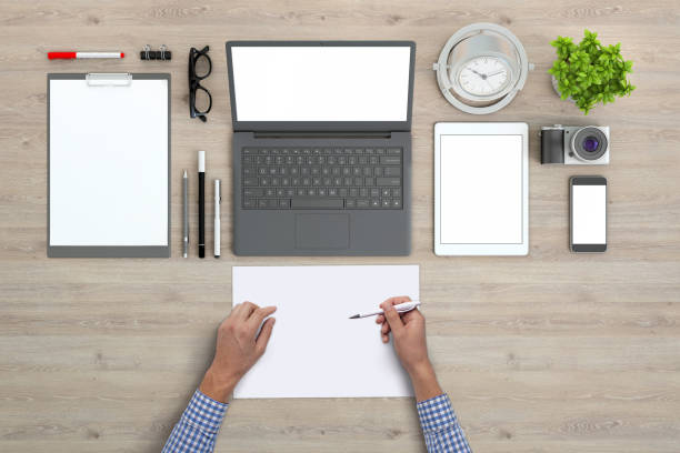 istock Man holding blank papers knolling overhead view 972151044