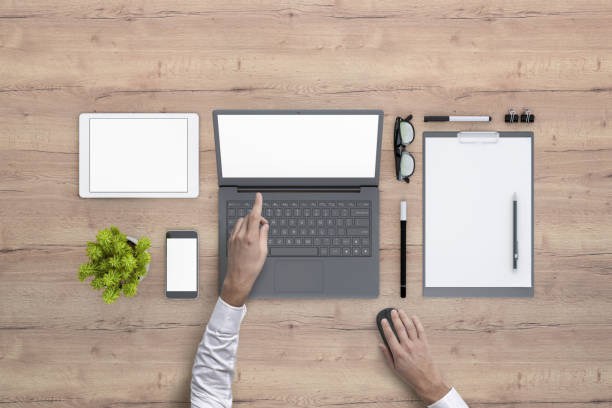 istock Man working on laptop knolling overhead view 972151060