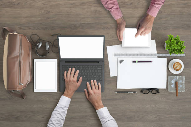 istock Business people working in office knolling overhead view 972151076