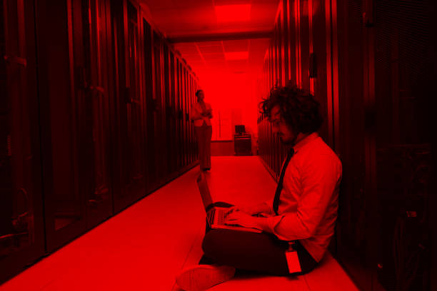 istock Team of young technicians working together on servers 972151130