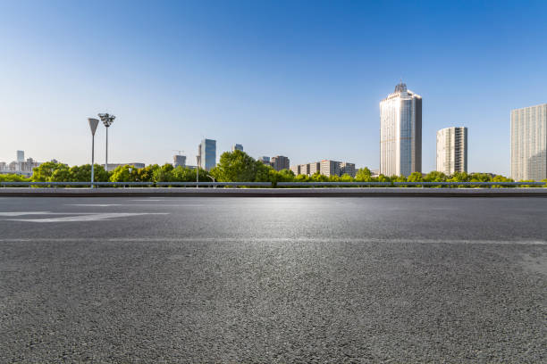 istock Panoramic skyline and modern business office buildings with empty road,empty concrete square floor 972151226