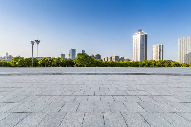 istock Panoramic skyline and modern business office buildings with empty road,empty concrete square floor 972151278