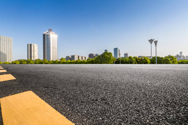 istock Panoramic skyline and modern business office buildings with empty road,empty concrete square floor 972151282