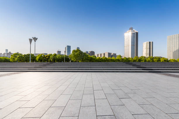 istock Panoramic skyline and modern business office buildings with empty road,empty concrete square floor 972151504