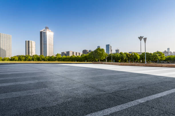 istock Panoramic skyline and modern business office buildings with empty road,empty concrete square floor 972151516