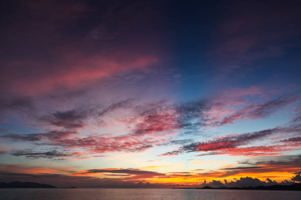 istock colorful sunset sky over tranquil sea surface 972151666