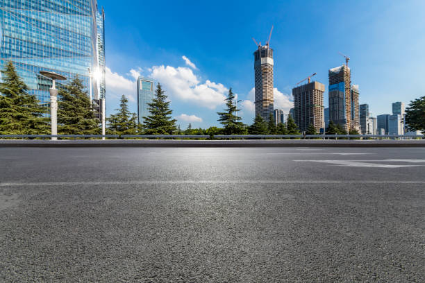 istock Panoramic skyline and modern business office buildings with empty road,empty concrete square floor 972152074