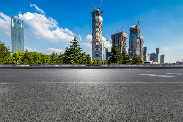 istock Panoramic skyline and modern business office buildings with empty road,empty concrete square floor 972154246