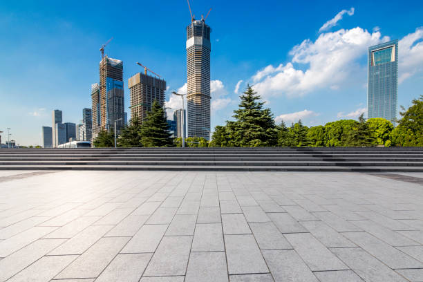 istock Panoramic skyline and modern business office buildings with empty road,empty concrete square floor 972155136