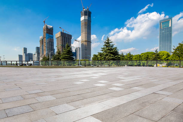 istock Panoramic skyline and modern business office buildings with empty road,empty concrete square floor 972155180