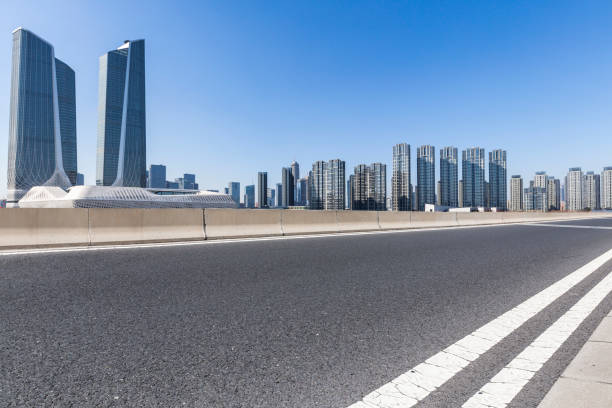 istock Panoramic skyline and modern business office buildings with empty road,empty concrete square floor 972155438