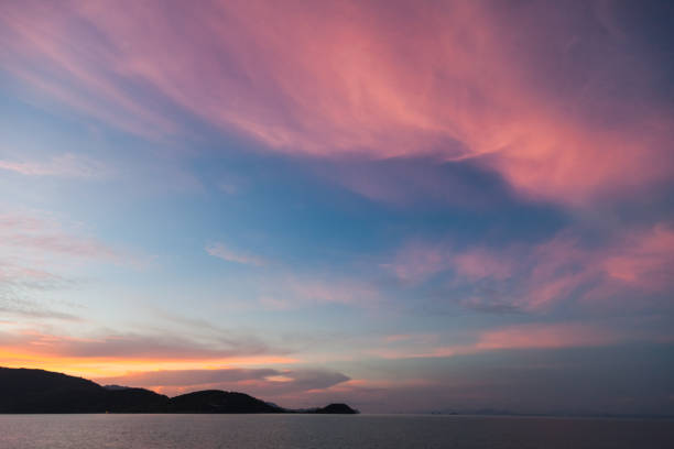 istock beautiful sunset seascape under pink cloudy sky 972156450
