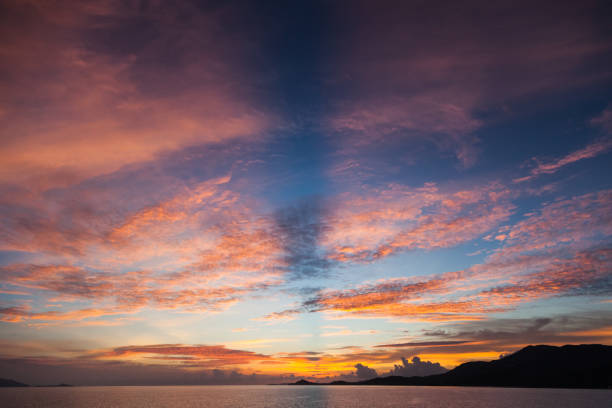 istock beautiful sunset over calm ocean surface 972157928