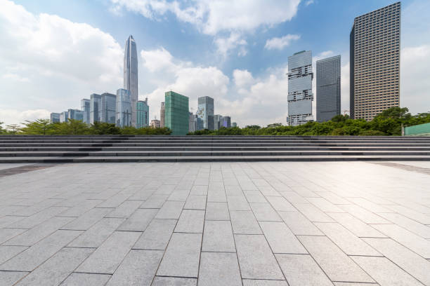 istock Panoramic skyline and modern business office buildings with empty road,empty concrete square floor 972158604