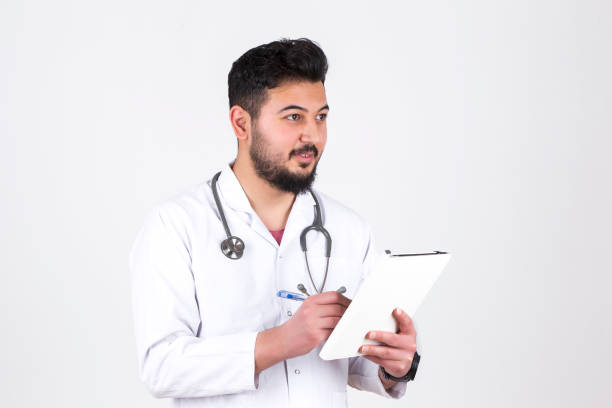 istock young handsome doctor portrait white background 972158698
