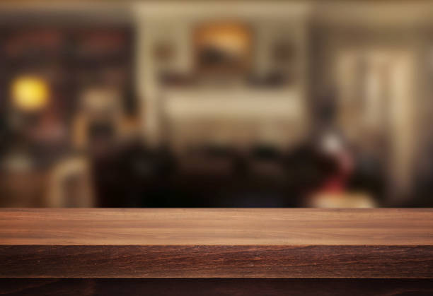 istock Wooden desk on interior background 972161618