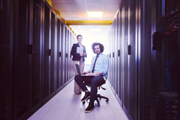 istock Team of young technicians working together on servers 972161762