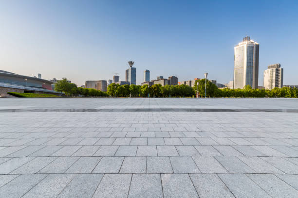 istock Panoramic skyline and modern business office buildings with empty road,empty concrete square floor 972162556