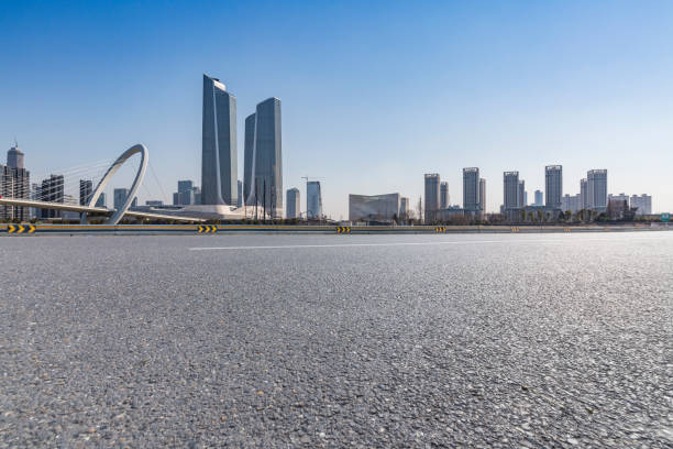 istock Panoramic skyline and modern business office buildings with empty road,empty concrete square floor 972164904