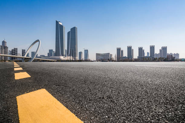 istock Panoramic skyline and modern business office buildings with empty road,empty concrete square floor 972165038