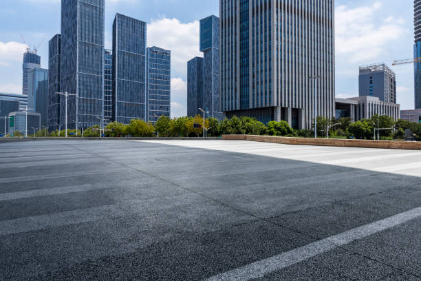 istock Panoramic skyline and modern business office buildings with empty road,empty concrete square floor 972165602