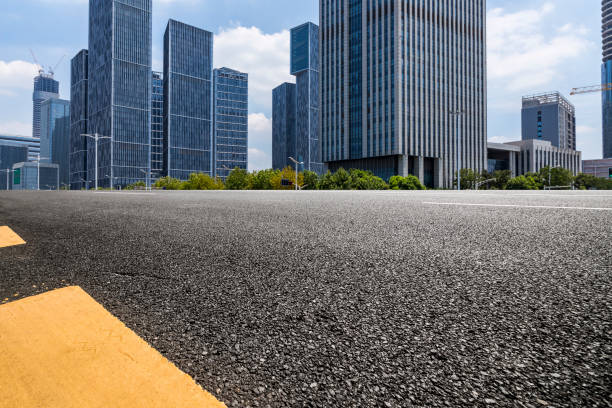 istock Panoramic skyline and modern business office buildings with empty road,empty concrete square floor 972166118