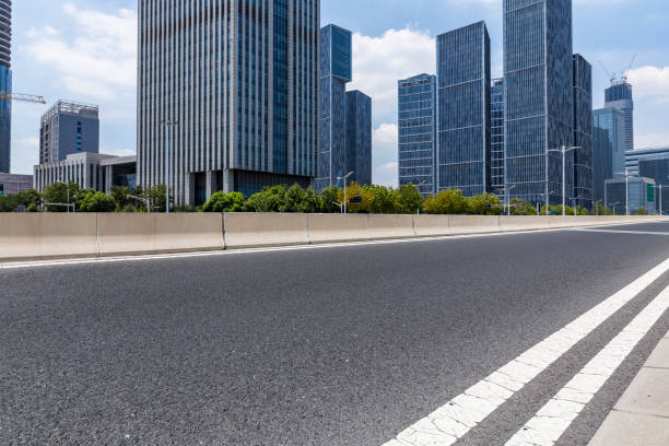 istock Panoramic skyline and modern business office buildings with empty road,empty concrete square floor 972170666