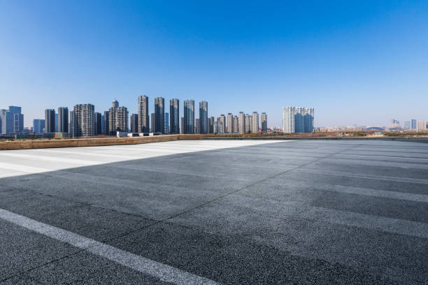 istock Panoramic skyline and modern business office buildings with empty road,empty concrete square floor 972171214