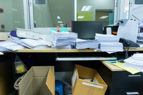 istock Busy, messy and cluttered workplace, full of documents 972176442