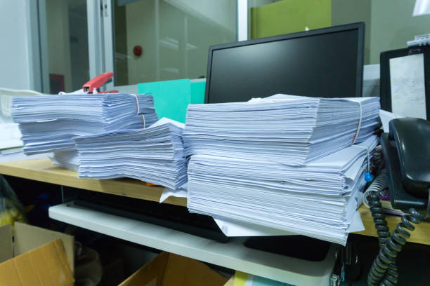 istock Busy, messy and cluttered workplace, full of documents 972176454