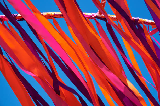 istock Multicolored ribbons flying in windy weather. Background 972176864