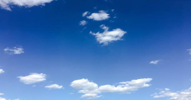 istock Beautiful clouds against a blue sky background. Cloud sky. Blue sky with cloudy weather, nature cloud. White clouds, blue sky and sun. 972179418