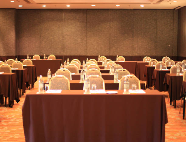 istock an empty conference meeting room in seminar hall with tables and chairs background 972179736