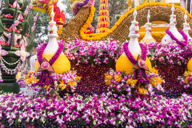 the parade cars are decorated with many kinds of flowers in annual 42th chiang mai flower festival, thailand - flower parade imagens e fotografias de stock