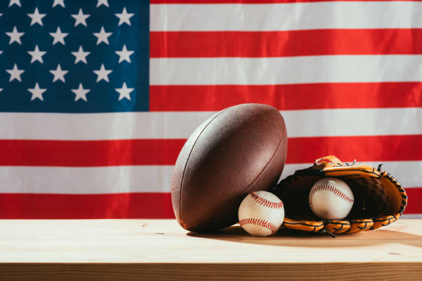 istock american flag and sport equipment on foreground 972182062