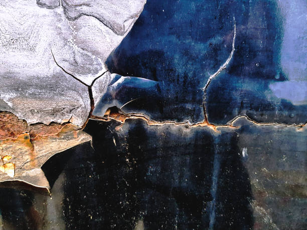istock Full Frame Background of Cracked Rusty Car Paint Texture 972187494