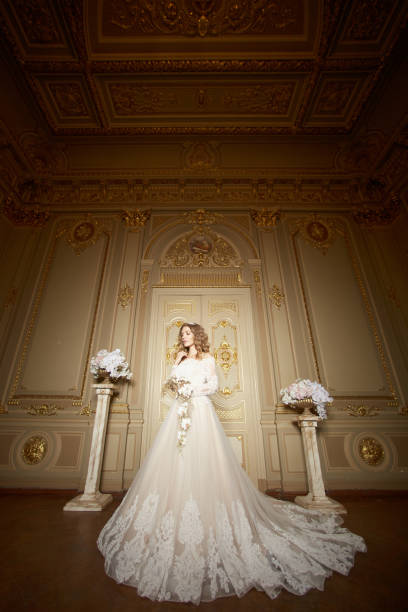 istock elegant stylish bride looking at rich interior in old building 972196518