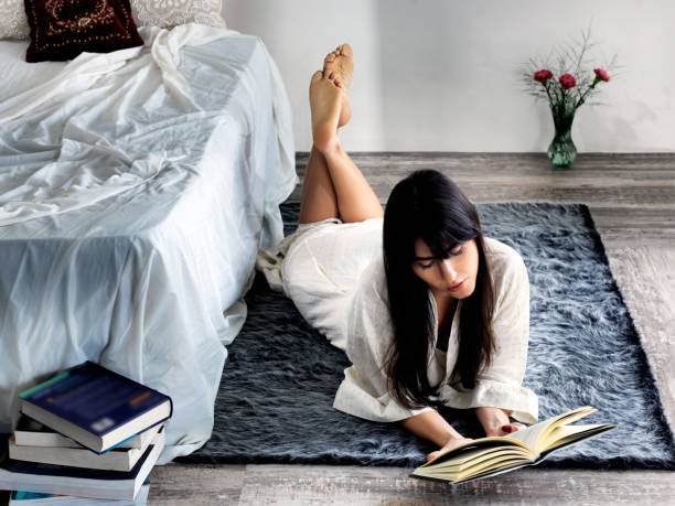 istock young woman studying and reading 972197272