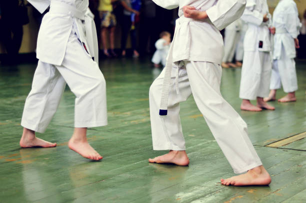 istock Kids of karate. Training and exam in karate. 972208712