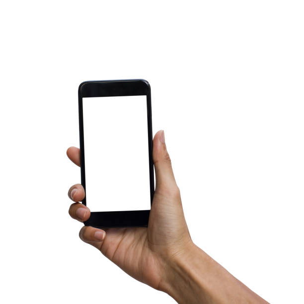 istock Man hand holding black smartphone with white screen for mock up design. isolated on white background. insert clipping path easy for use. 972213576