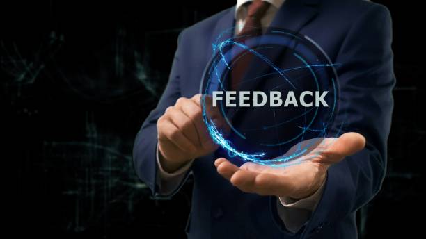 istock Businessman shows concept hologram Feedback on his hand 972228862