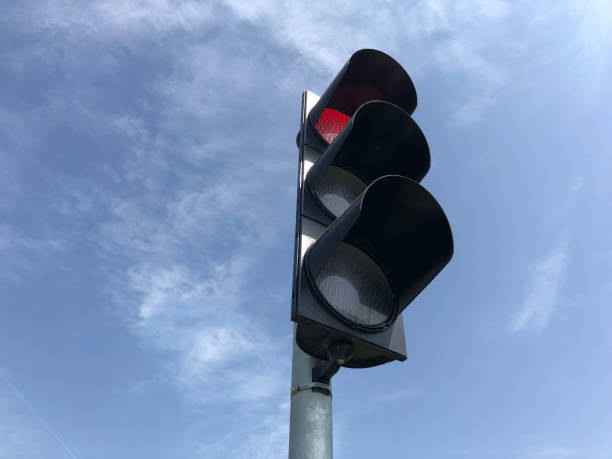 istock Traffic lights over blue sky 972250222