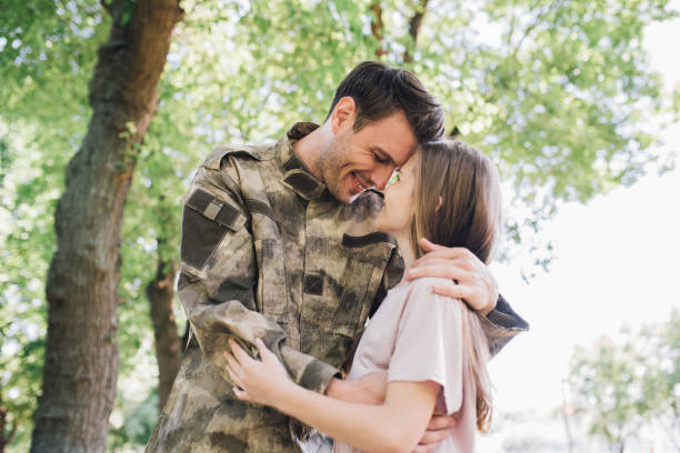 istock Soldier hugging with his daughter 972250558