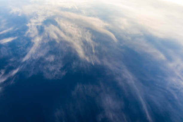 istock Blue dark sky with windy clouds on an abstract background 972285058