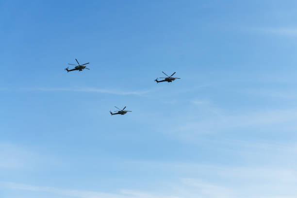 istock In a clear blue sky, a helicopter with screw engines 972310012