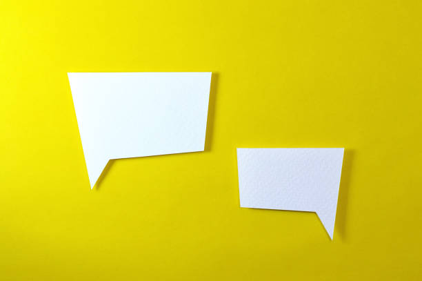 istock couple of irregular text bubble on yellow background 972310448