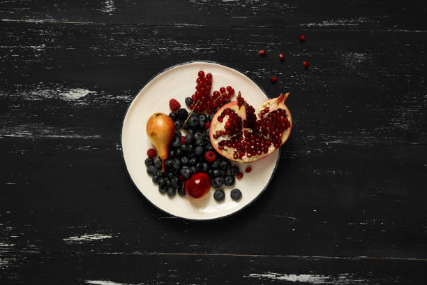 Fruits and berries lying on round plate