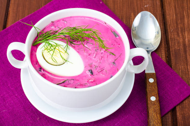 istock Cold beet soup with egg, fresh herbs, cucumber and herbs 972315770