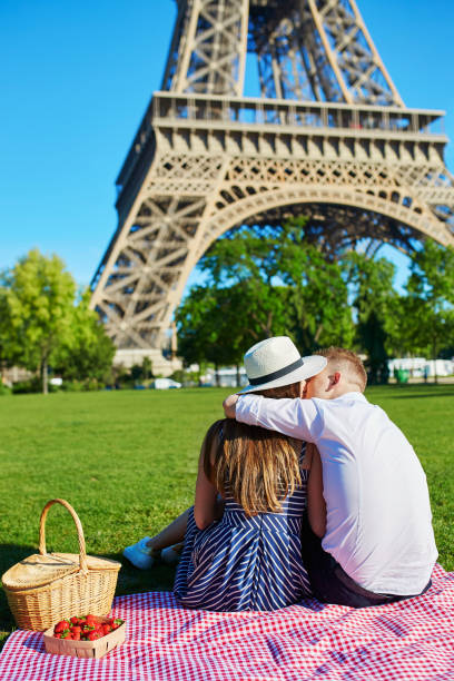 istock Romantic couple having picnic together in Paris 972315848