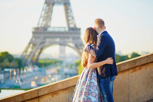 istock Romantic couple near the Eiffel tower in Paris 972316002